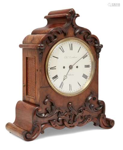 A Victorian walnut eight day mantel clock