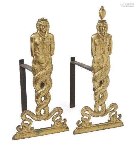 A pair of polished brass figural andirons