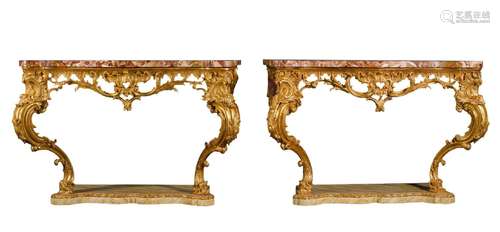 A pair of George III style carved giltwood console tables