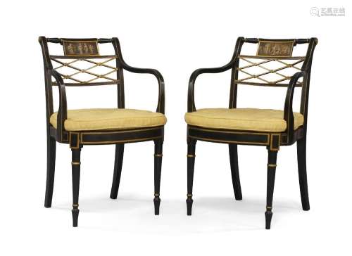 A pair of Regency ebonised armchairs
