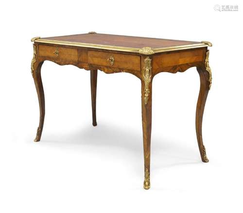 A French rosewood and walnut bureau plat