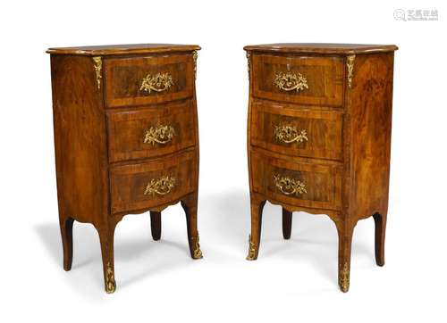 A pair of French burr walnut serpentine front bedside commod...