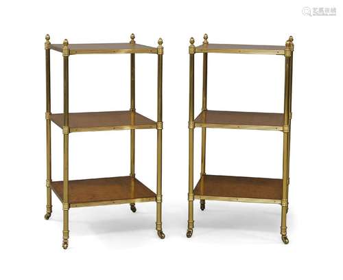 A pair of French brass three tier side tables