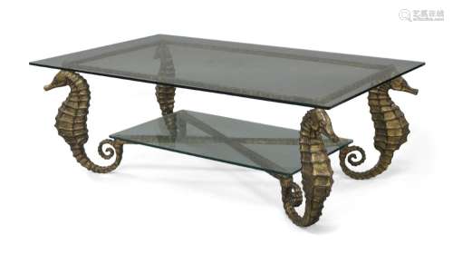 A wrought iron and glass two tier coffee table