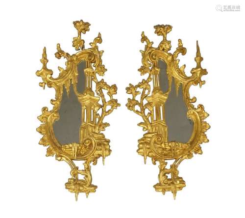 A pair of George III carved gilt wood wall mirrors