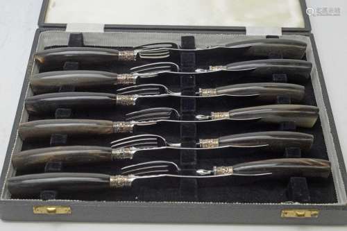 A set of six steak knives and forks, by Walker & Hall,