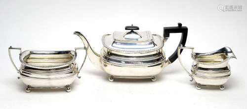 A three piece Edwardian silver tea service, by James Dixon &...