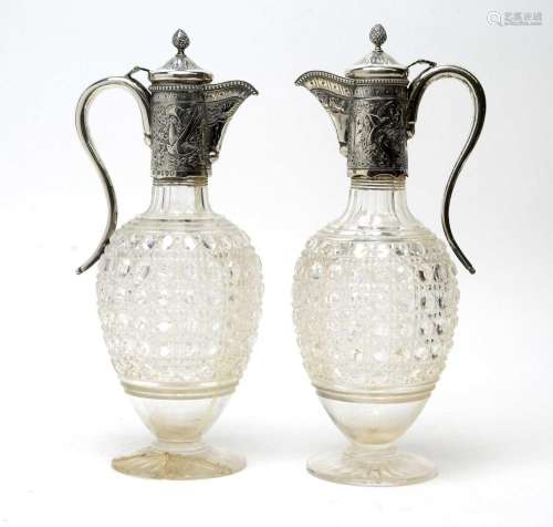 A pair of silver mounted cut glass decanters, by Charles Boy...