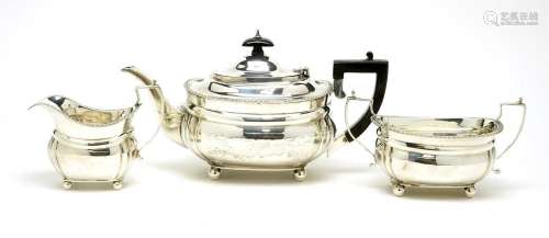 A George V silver three piece tea service, by Charles Stuart...