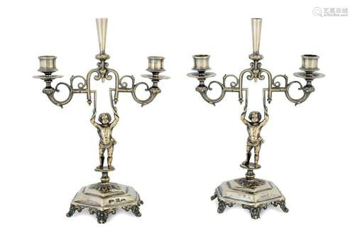 A pair of silver plated candelabra by Meneses