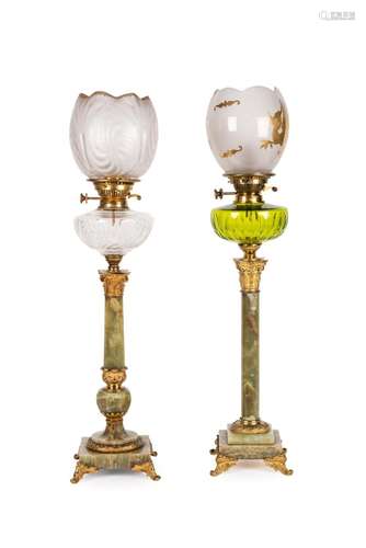 A pair of gilded bronze and onix oil lamps 19th C