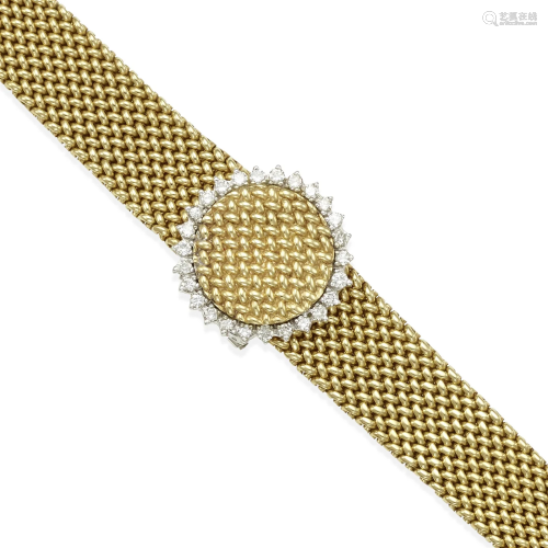 GENEVE: A 14K GOLD AND DIAMOND SURPRISE WATCH