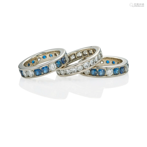 A GROUP OF THREE PLATINUM, SAPPHIRE AND DIAMOND ETERNITY BAN...