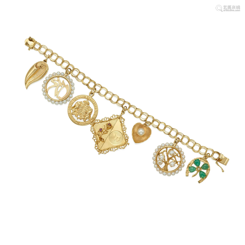 A 14K GOLD CHARM BRACELET