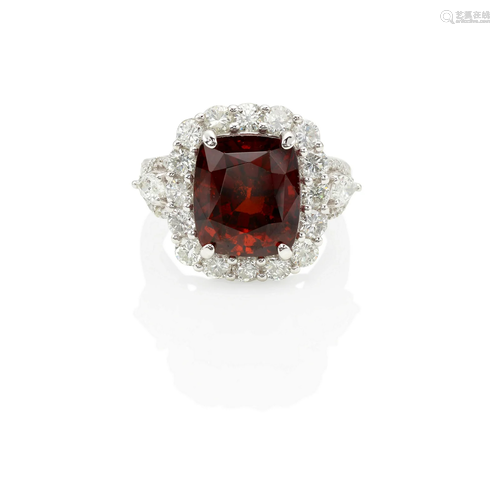 AN 18K WHITE GOLD, GARNET AND DIAMOND RING