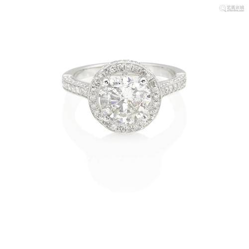 AN 18K WHITE GOLD AND DIAMOND RING