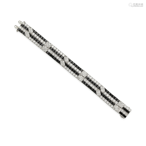 A PLATINUM, ONYX AND DIAMOND BRACELET, CIRCA 1920