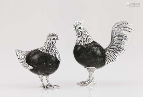 A cockerel and hen