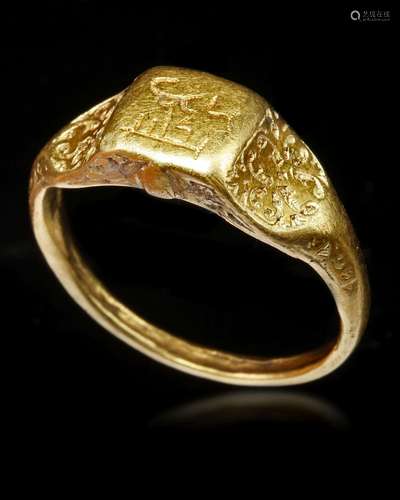 A GOLD SEAL RING