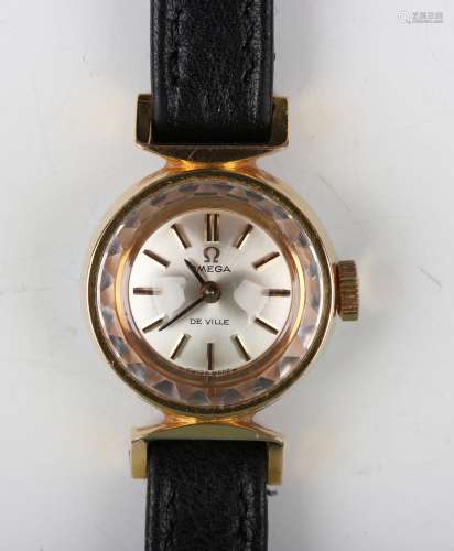 An Omega De Ville gilt metal fronted and steel backed lady's...