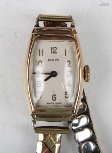 A Rolex 9ct gold curved rectangular cased lady's wristwatch,...