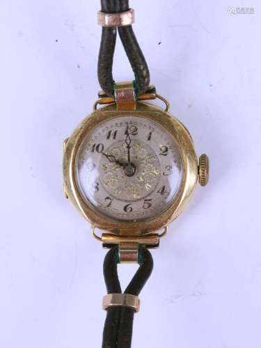 An 18ct gold cased lady's wristwatch, the silvered dial with...