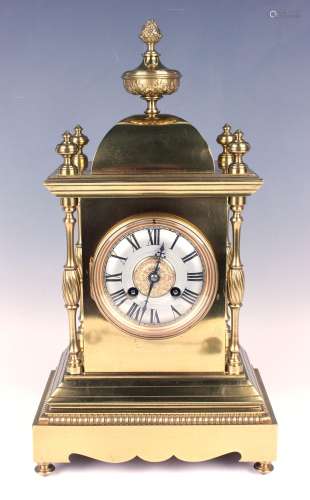 A late 19th century French lacquered brass mantel clock with...