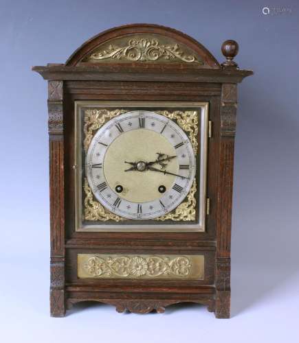 A late 19th century oak mantel clock with two train eight da...