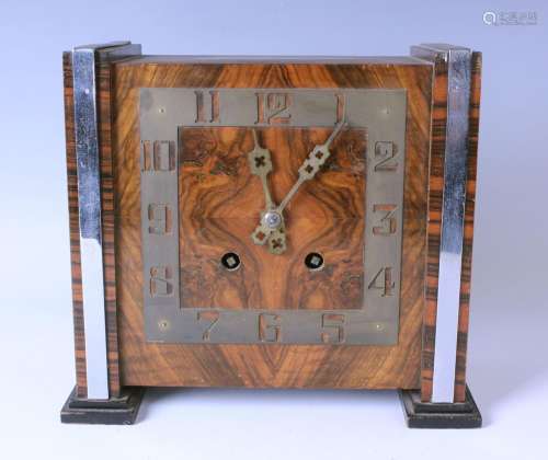 An Art Deco walnut mantel clock with eight day Empire moveme...
