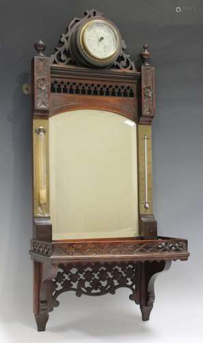 A late Victorian mahogany wall shelf with circular barometer...