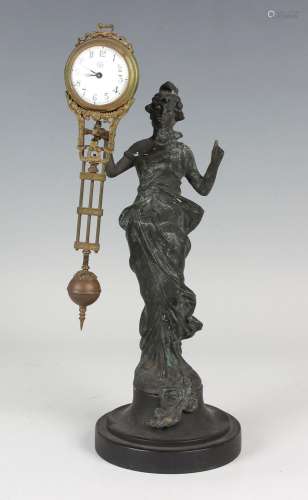 An early 20th century spelter mystery timepiece, the brass c...