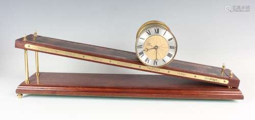 A late 20th century brass and mahogany inclined plane gravit...