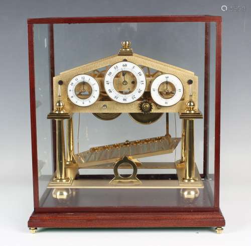 A late 20th century gilt brass Congreve rolling ball clock, ...