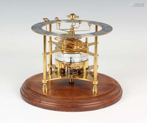 A late 20th century brass astrological orrery calendar clock...