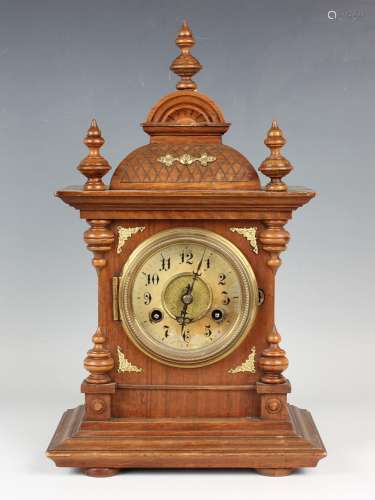 A late 19th century German beech cased mantel clock with Jun...