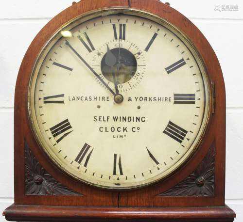 A late 19th century walnut electric regulator wall clock, th...