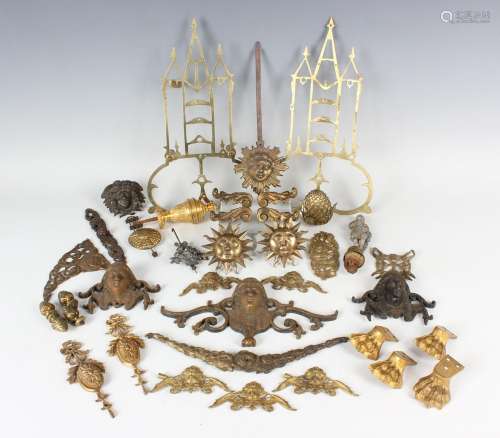 A collection of brass clock parts and mounts, including fini...