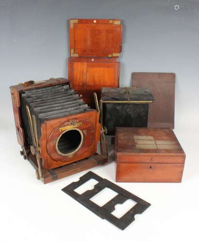 A Houghton & Son mahogany and brass folding plate camera...