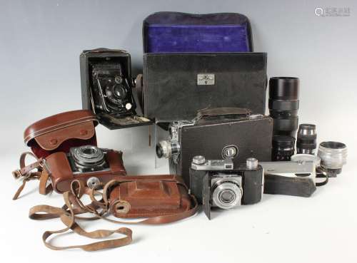 A selection of assorted camera accessories and lenses, inclu...