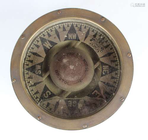 A brass cased gimbal mounted 9¼-inch ship's compass, the dia...