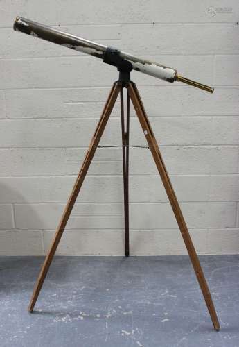 An early 20th century brass and partially painted telescope,...