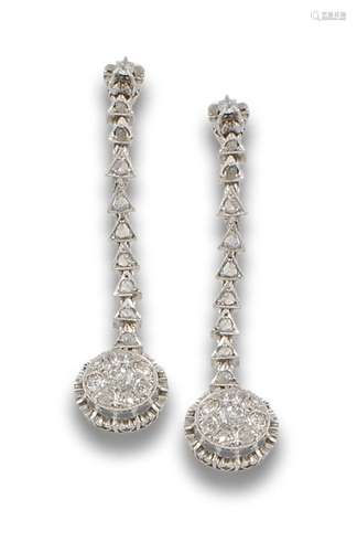 Long 18 kt white gold earrings.