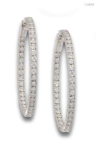 Creole "in & out" earrings in 18 kt white gold...