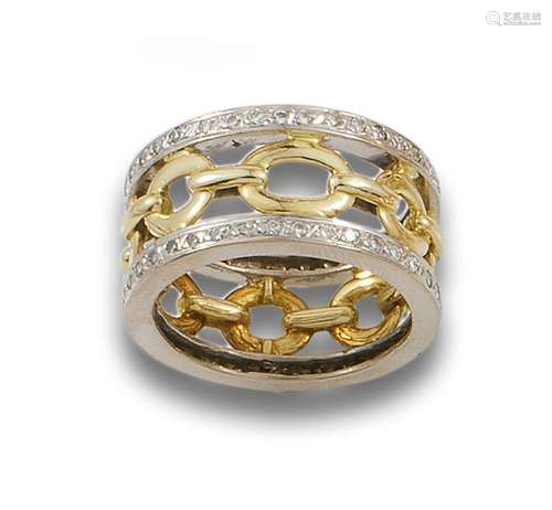 Wide openwork ring in 18 kr white and yellow gold.