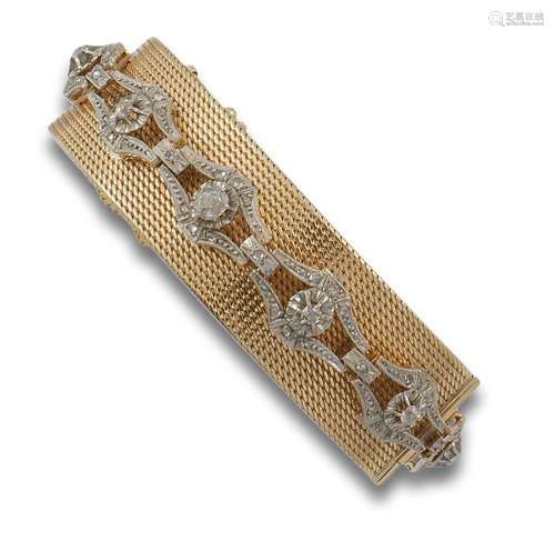 18 kt yellow gold mesh bracelet.