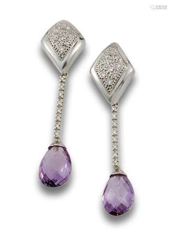 Long 18 kt white gold earrings.