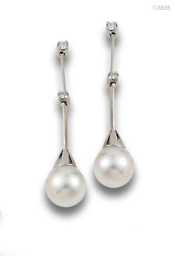 Long 18 kt white gold earrings.