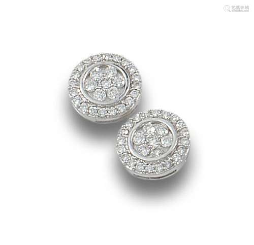 18 kt white gold rosette earrings.