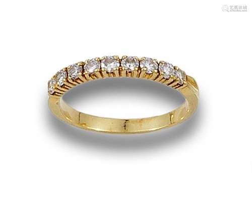 18 kt yellow gold half alliance ring.