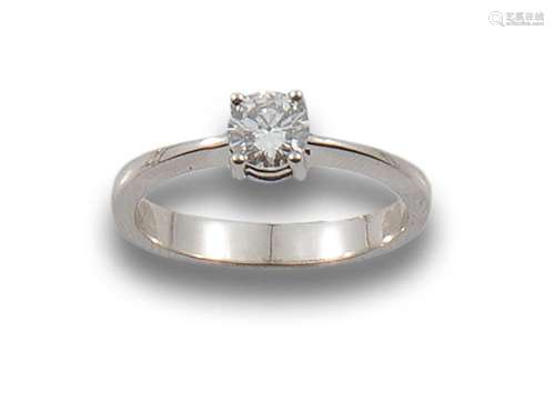 18 kt white gold solitaire.